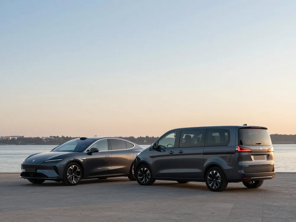 Electric executive car and passenger van by the Lisbon riverside