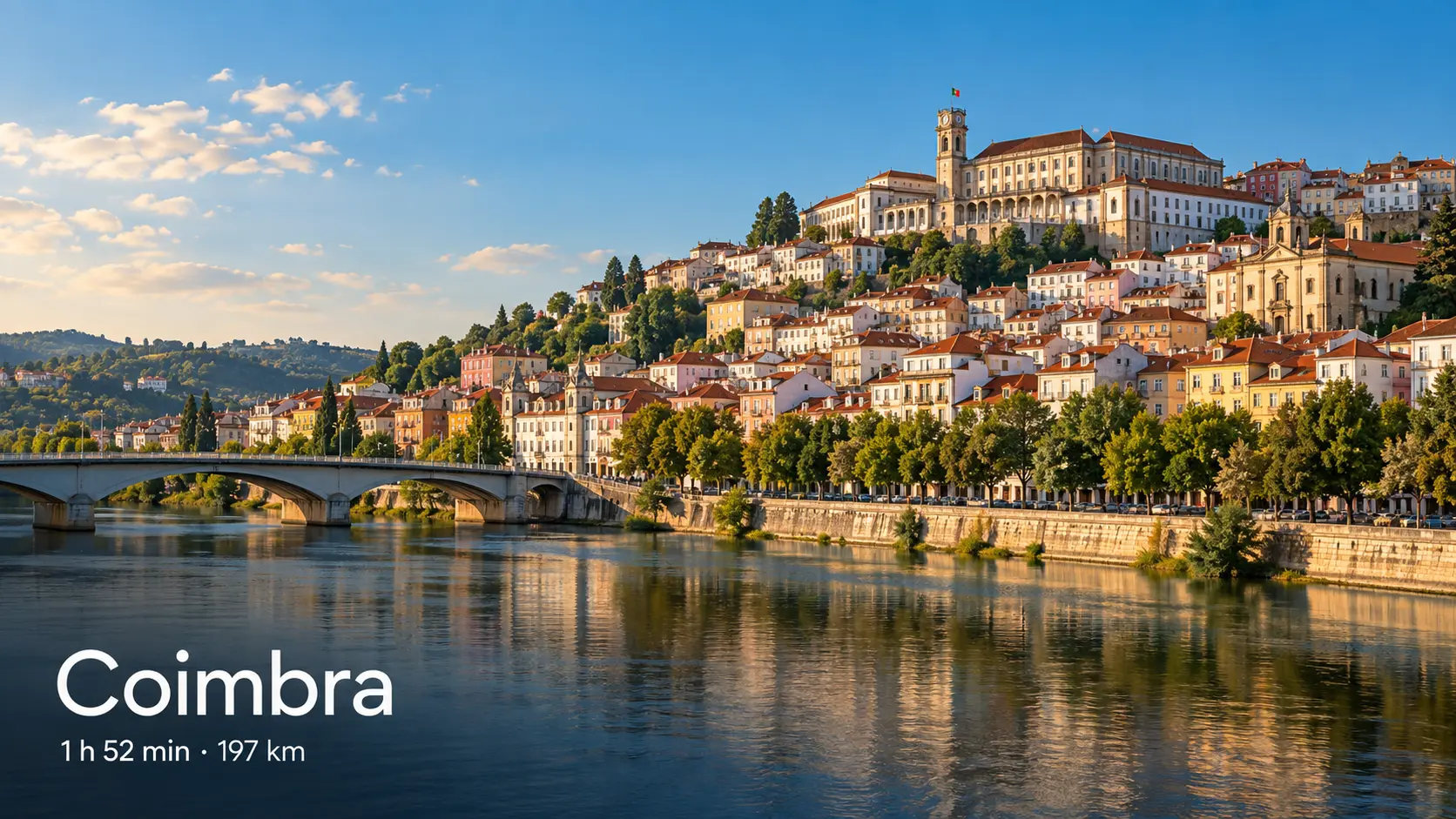 Hillside university city of Coimbra reflected in the Mondego river beside an arched bridge